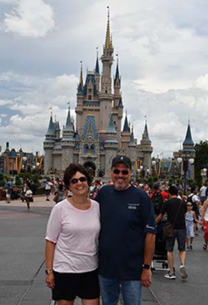 Nicole Dull and husband in front of Disney World Castle