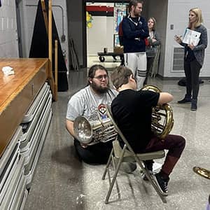 People looking at musical horns