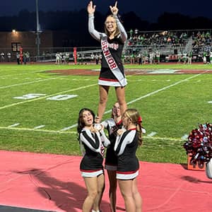 cheerleaders creating a human pyramid