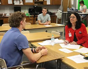 Student talking to an adult