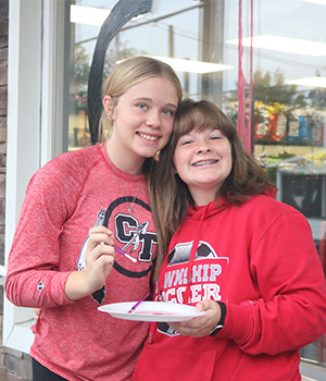 Two high school girls smiling for the camera