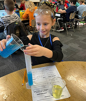 Girl working on a chemistry project