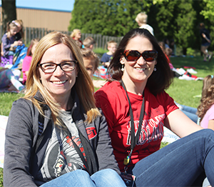 Two women having fun at a school game