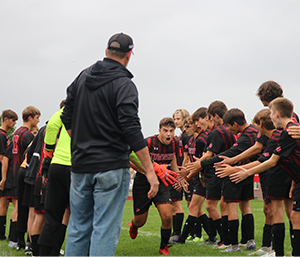 Soccer players cheering each other on